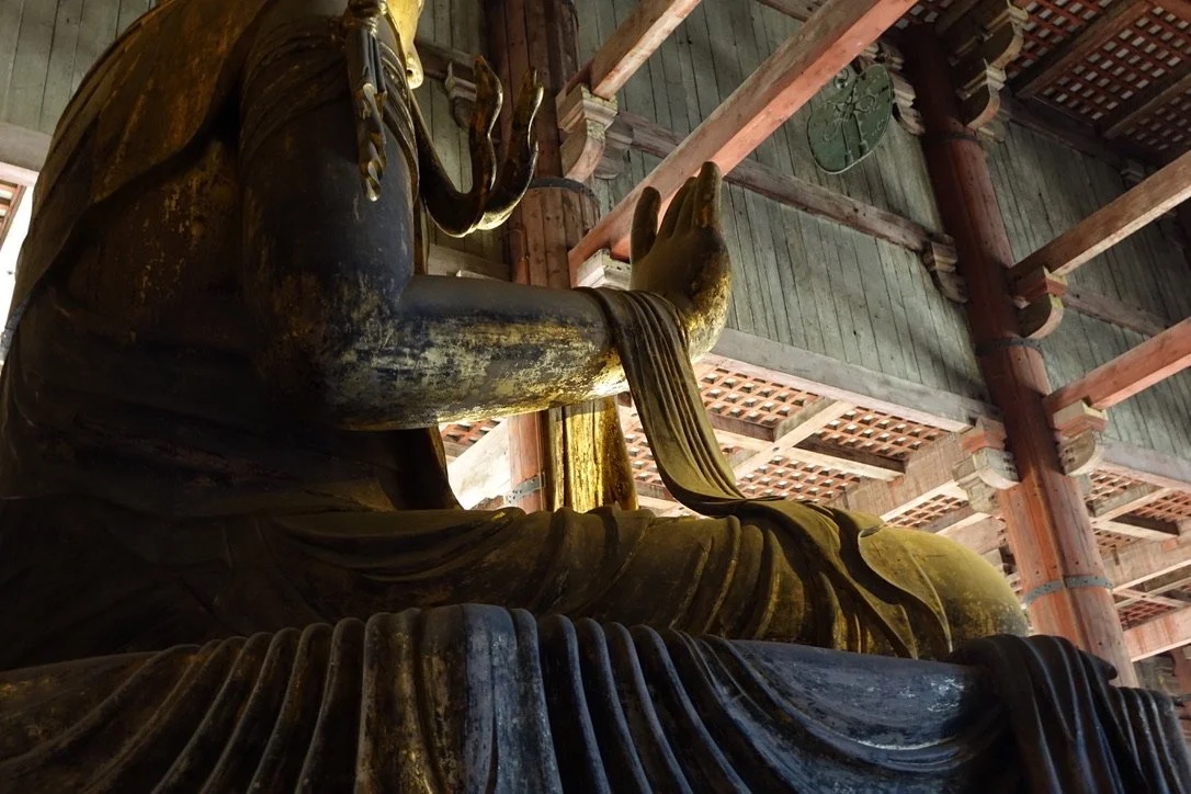 Beneath the Great Buddha’s arm.