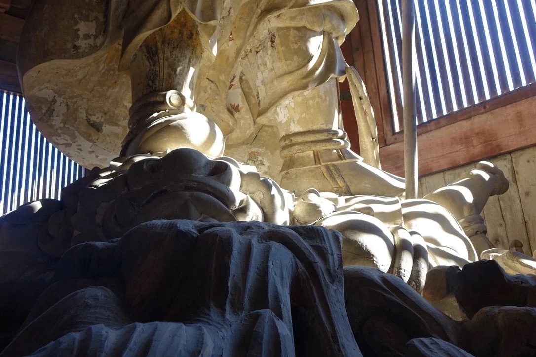 Guardian figure in dramatic light.