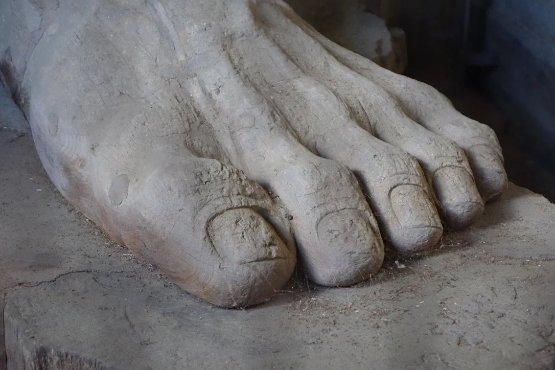 A monumental stone Buddha foot.