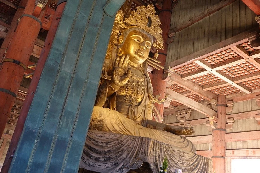A gilded flanking bodhisattva inside the Great Buddha Hall.