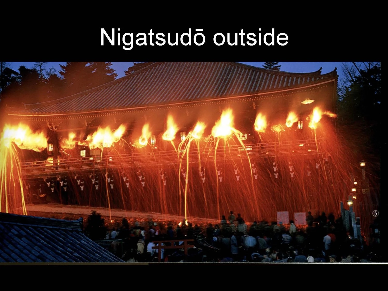 Slide: Omizutori torches blaze at the Nigatsudō.