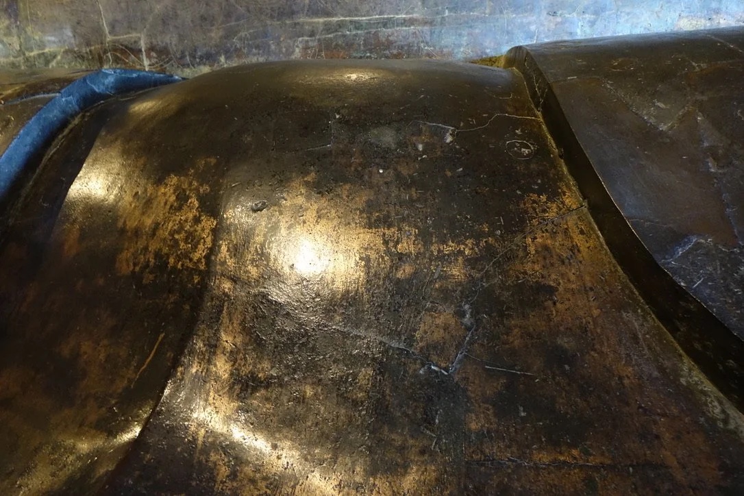 Engraved bronze petal surface.
