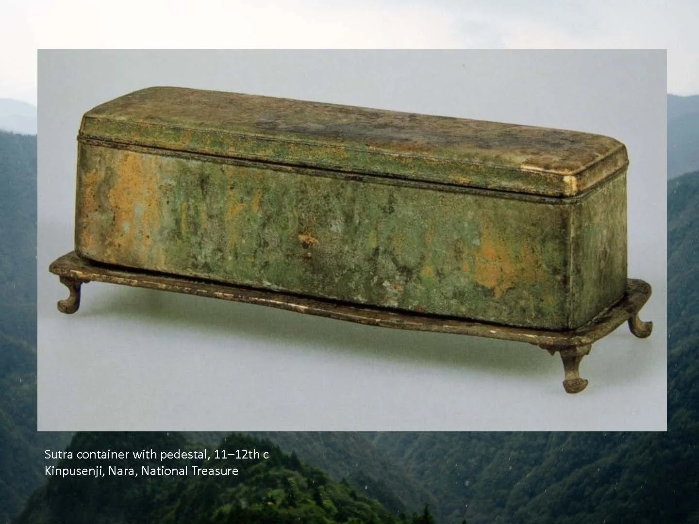 Slide: a gilt bronze sutra container.