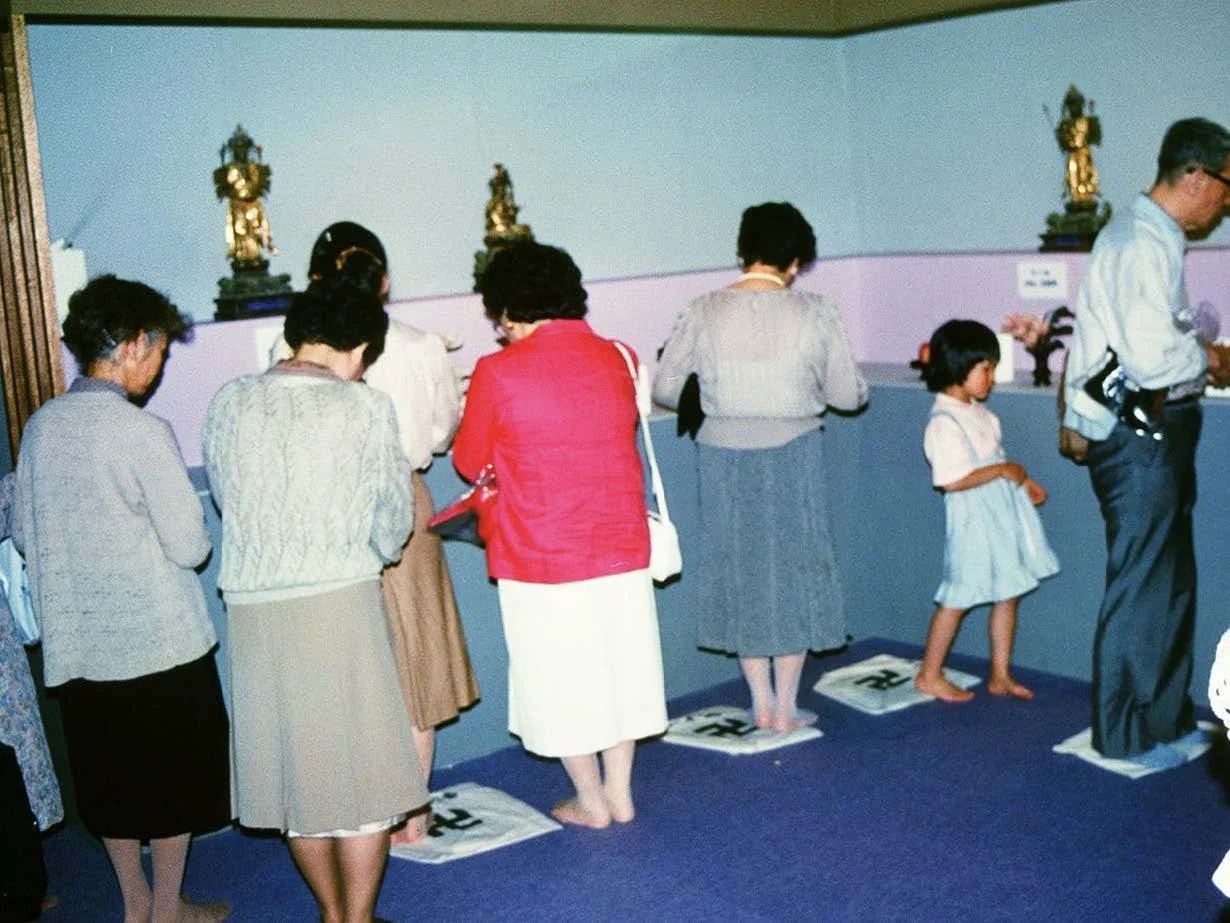 Slide: women walking an indoor miniature circuit.