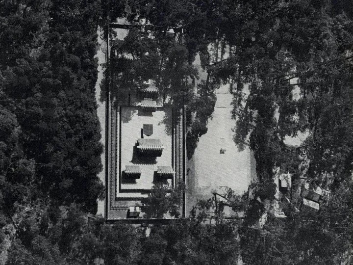 Slide: aerial photograph of Ise amid forest.